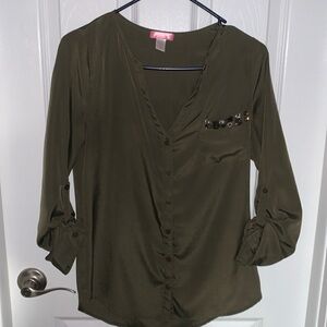 Green satiny blouse with gem stones on breast pocket